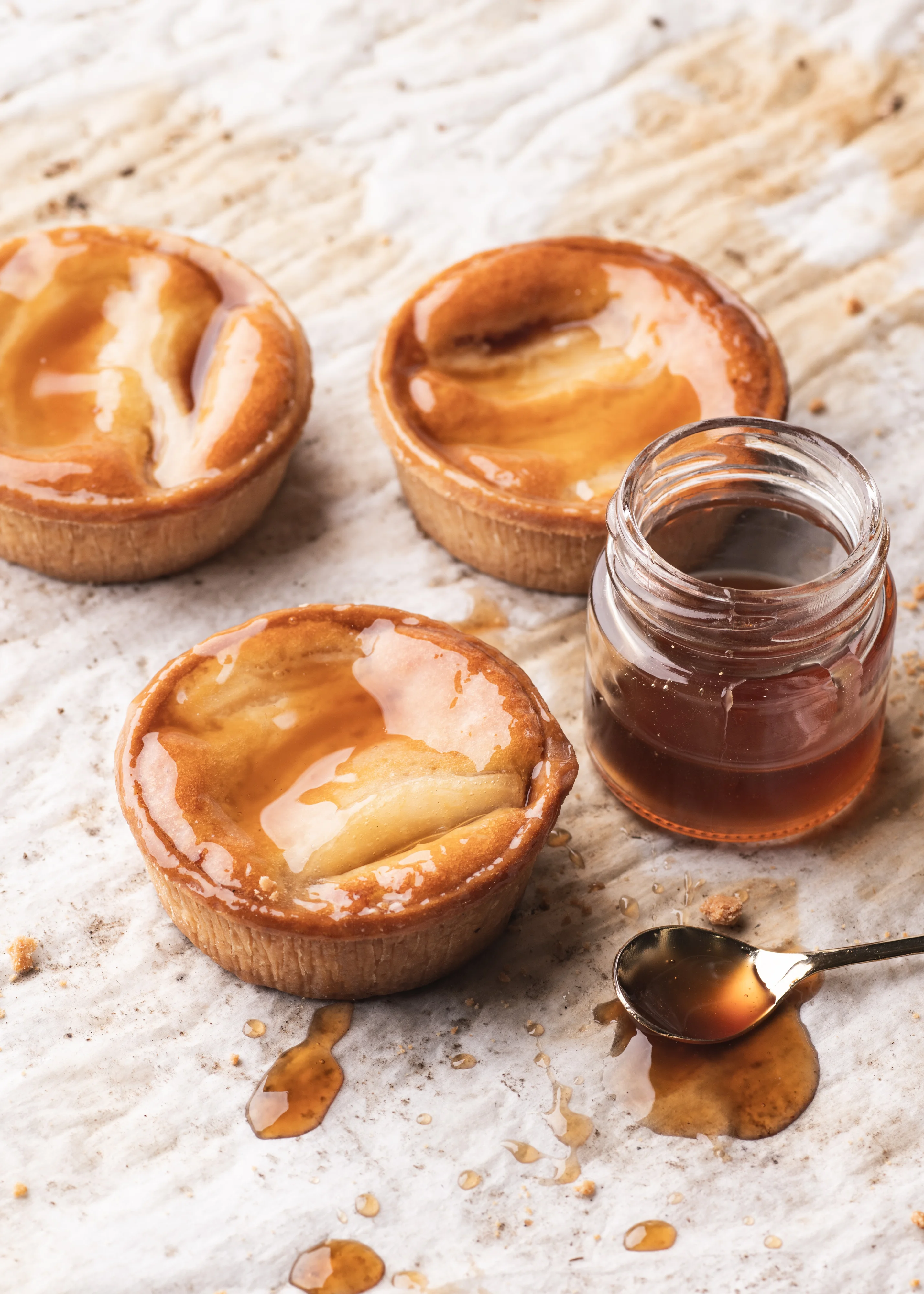 Almond and pear tart, golden frangipane filling, sliced pears arranged in a spiral.